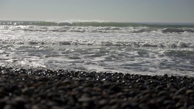View from the water of the beach, the surf and the ocean at Leucadia.