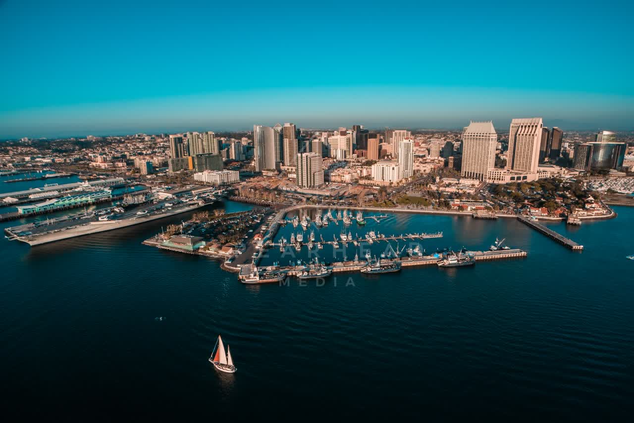 Aerial view of the harbor, the skyline and boats at San Diego Marina, with boats out.