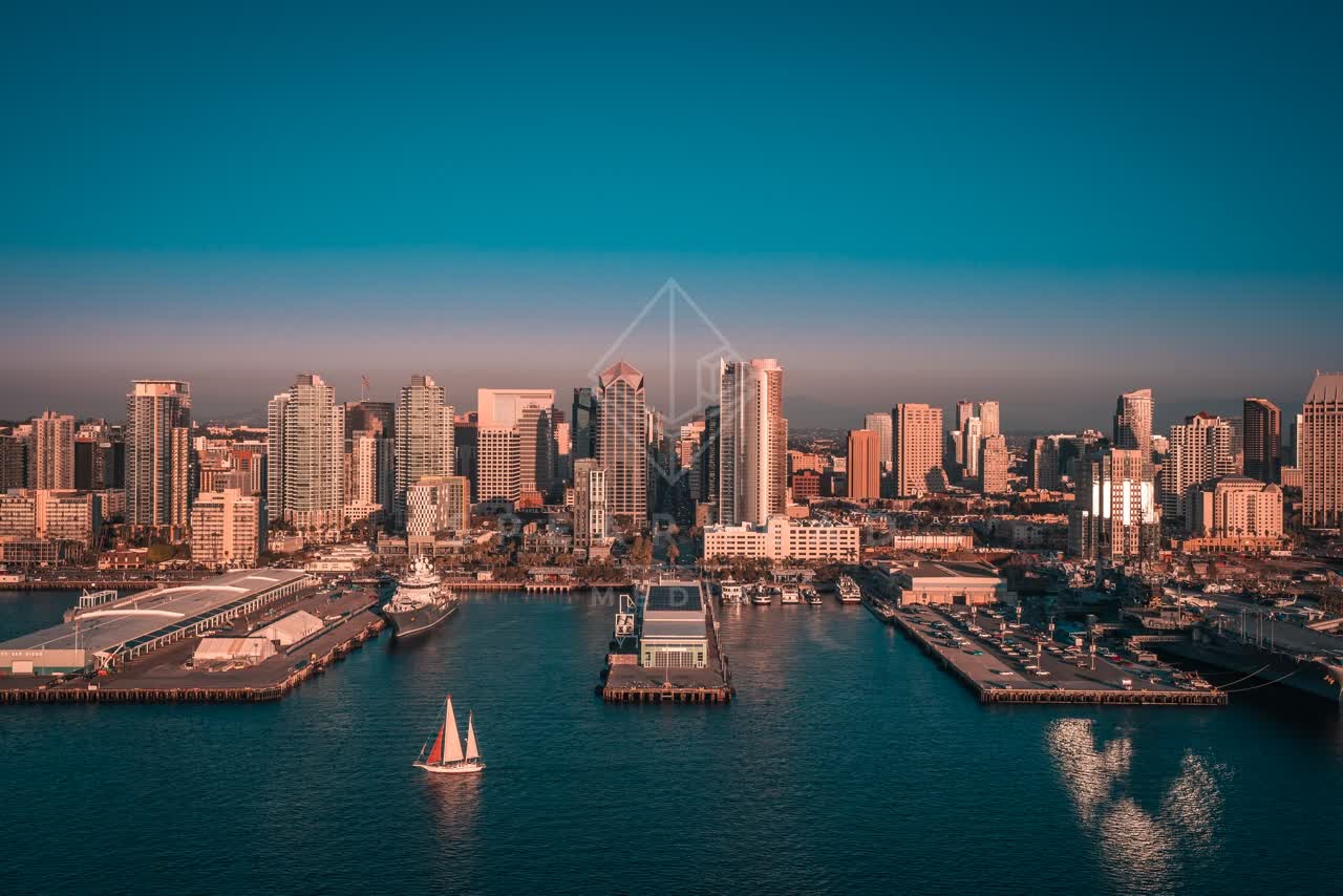 Aerial view of the harbor, the pier and the skyline at San Diego Marina, with boats out.