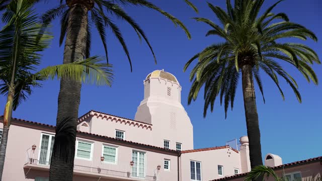 The downtown streets, palm trees and the buildings at La Jolla Cove.