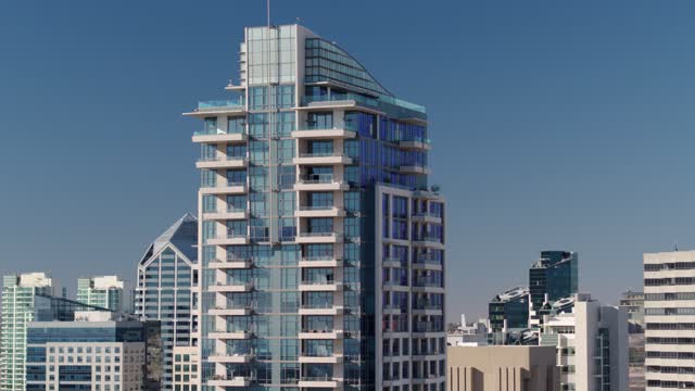 Low aerial view of the downtown streets, the skyline and the buildings at Marina.