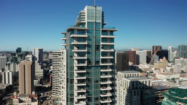 Low aerial view of the downtown streets, the skyline and the buildings at Marina.