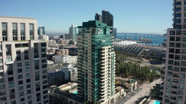 Low aerial view of the downtown streets, the bridge and the skyline at Marina.