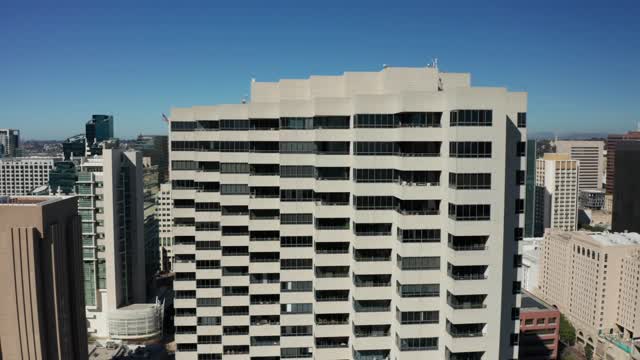 Low aerial view of the downtown streets, the skyline and the buildings at Marina.