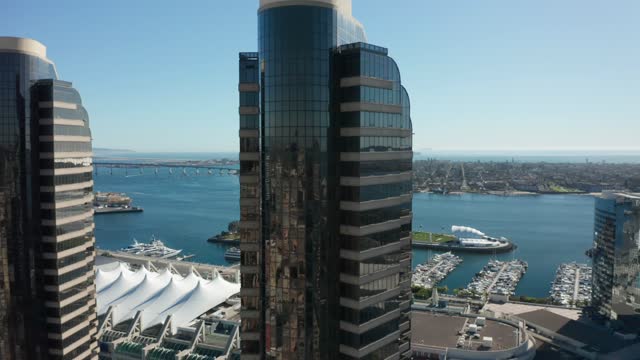 Low aerial view of the downtown streets, the bridge and the skyline at Marina.