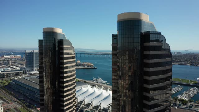 Low aerial view of the downtown streets, the bridge and the skyline at Marina.
