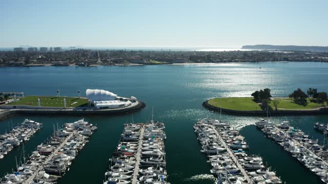 Aerial view of the harbor, boats and the bay at Marina, with boats out.