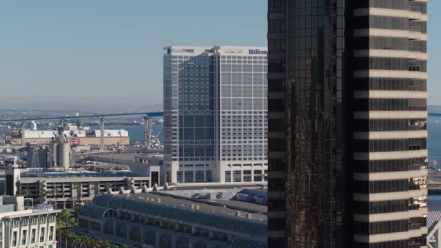 Low aerial view of the downtown streets, the bridge and the skyline at Marina.