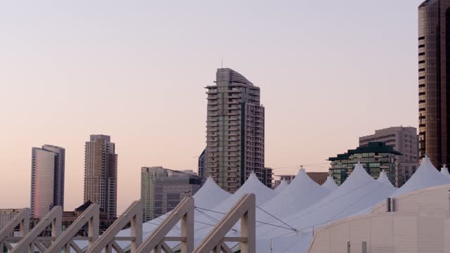 Low aerial view of the downtown streets, the skyline and the buildings at Marina.