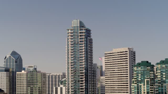 Low aerial view of the downtown streets, the skyline and the buildings at Marina.