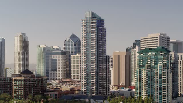 Low aerial view of the downtown streets, the skyline and the buildings at Marina.