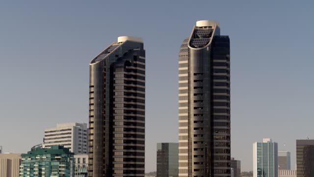 Low aerial view of the downtown streets, the skyline and the buildings at Marina.