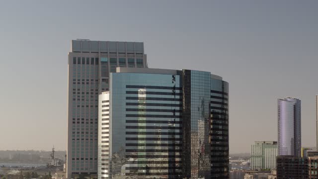 Low aerial view of the downtown streets, the skyline and the buildings at Marina.