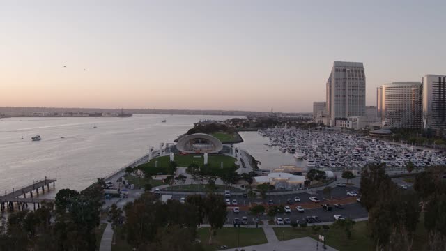 Aerial view of the harbor, the pier and the skyline at Marina, with boats out.