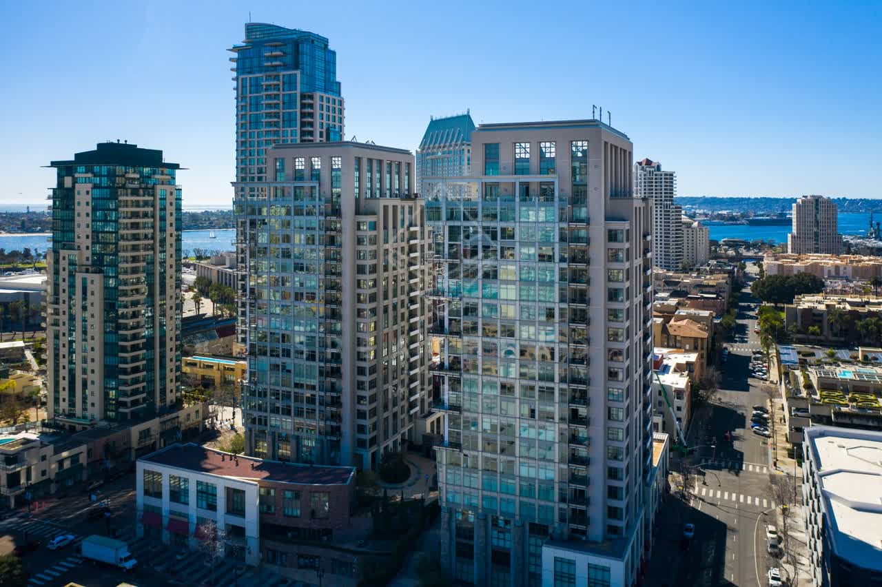 Low aerial view of the downtown streets, the skyline and the bay at San Diego Marina.