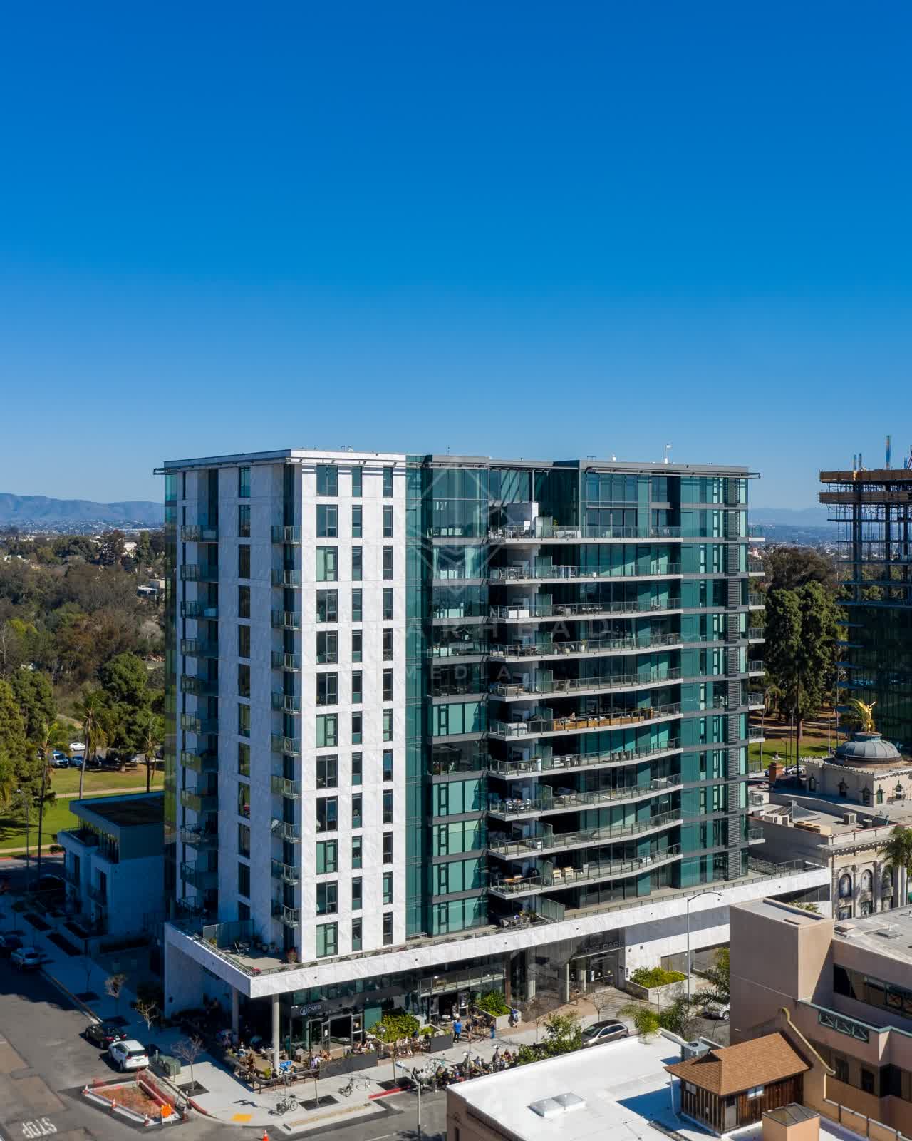 Low aerial view of the downtown streets, palm trees and the buildings at Bankers Hill.