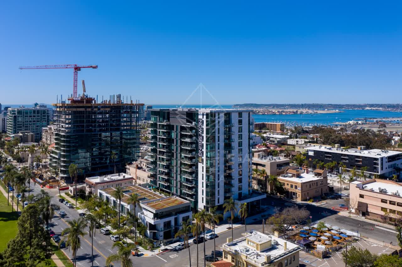 Aerial view of the downtown streets, boats and palm trees at Bankers Hill, with a work crew on site.