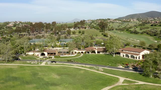 Low aerial view of the country inland, homes and the buildings in Santaluz.