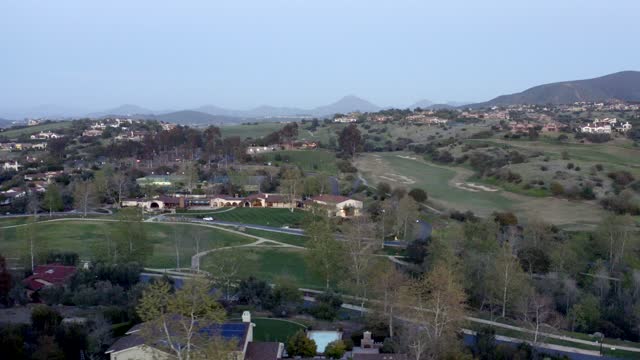 Aerial view of the country inland, homes and traffic in Santaluz.