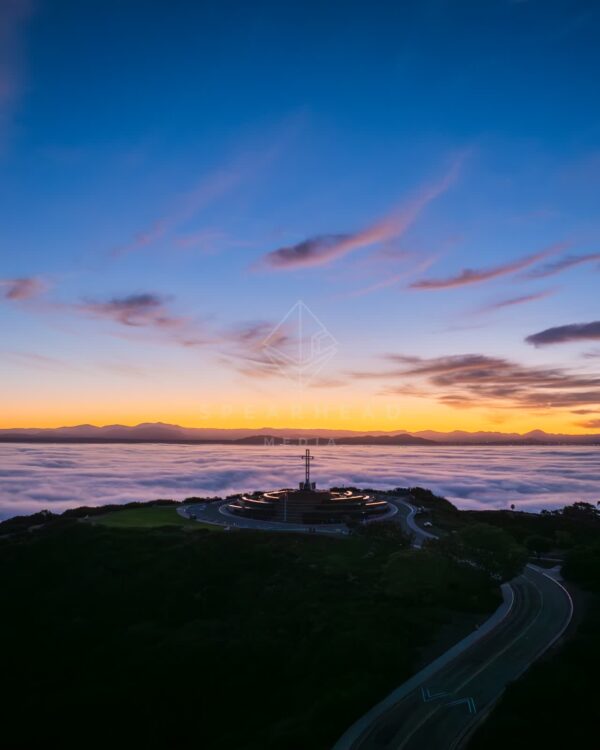 Mount Soledad and the Mt. Soledad National Veterans Memorial over the clouds and fog during sunrise in La Jolla | Drone Photo - 6