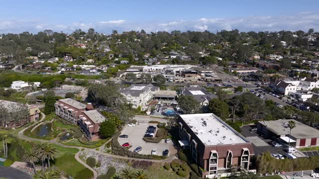 Aerial view of a residential street, palm trees and homes at Powerhouse Park.
