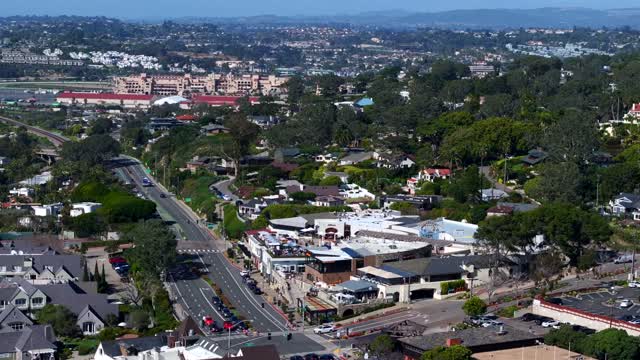 Aerial view of a residential street, homes and the buildings at Powerhouse Park.
