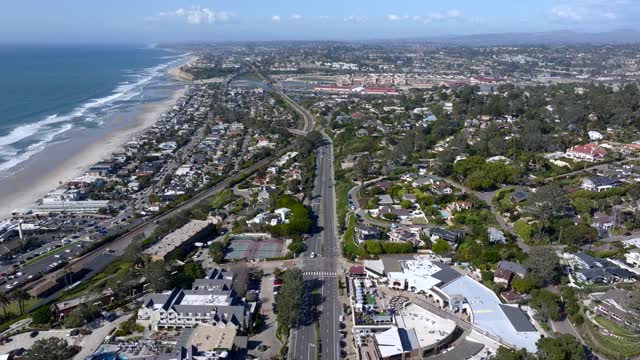 Aerial view of a residential street, the ocean and homes at Powerhouse Park.