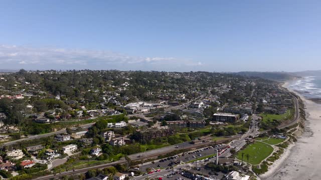 Aerial view of a residential street, the ocean and homes at Powerhouse Park.