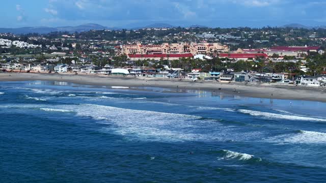 Aerial view of the beach, the surf and the ocean at Powerhouse Park.