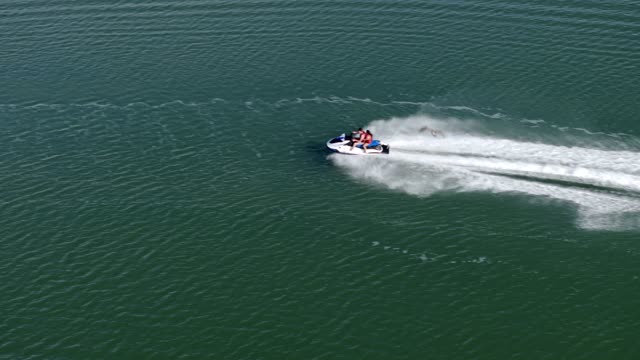 Aerial view of the country inland, boats and traffic in Carlsbad, with boats out.