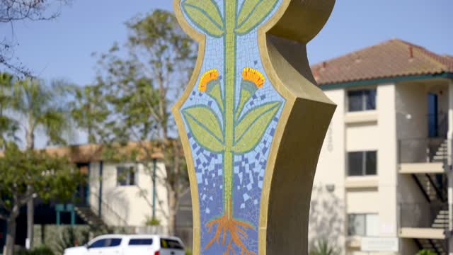 Close view of a park, palm trees and homes in Carlsbad.
