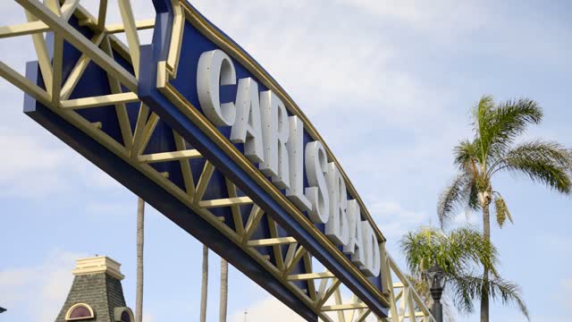 The downtown streets, palm trees and the buildings in Carlsbad.