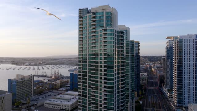 Low aerial view of the downtown streets, the skyline and boats at Columbia.
