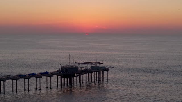 Low aerial view of the beach, the pier and the ocean at La Jolla Shores.