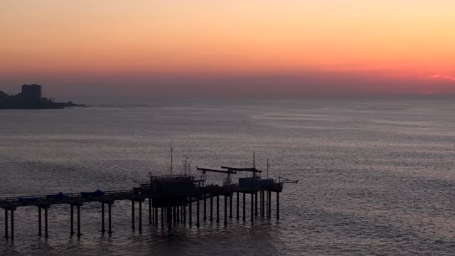 Low aerial view of the beach, the pier and the ocean at La Jolla Shores.