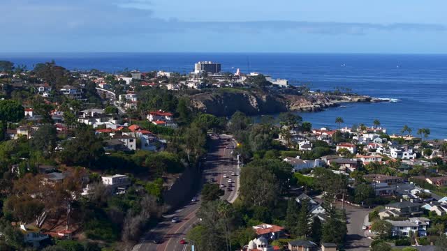 Aerial view of a residential street, the ocean and homes at La Jolla Shores.