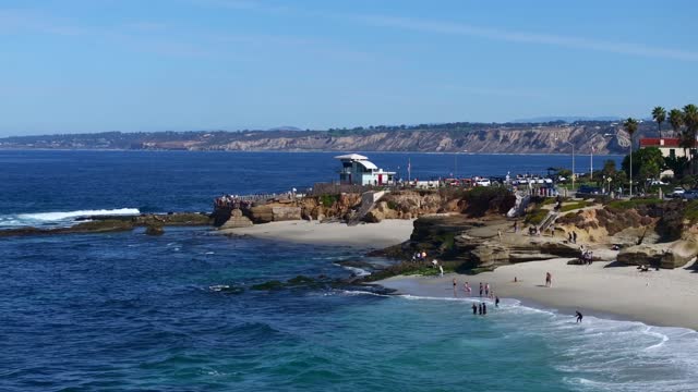 Aerial shot of Children’s Pool in La Jolla on a beautiful Day with Blue Skies | Drone Video