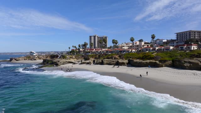 Aerial shot of Wipeout Beach in La Jolla on a beautiful Day with Blue Skies | Drone Video – 1