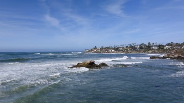 Aerial shot of the Bird Rock Neighborhood in La Jolla on a beautiful Day with Blue Skies | Drone Video – 4