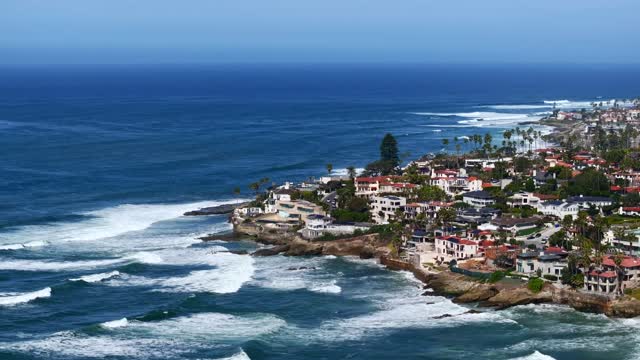 Aerial shot of the Bird Rock Neighborhood in La Jolla on a beautiful Day with Blue Skies | Drone Video – 7