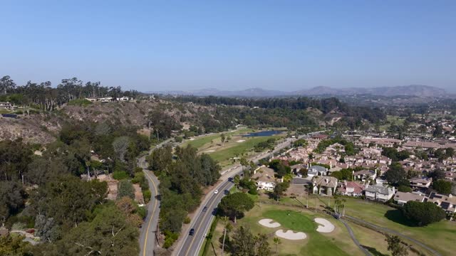 Aerial view of a residential street, homes and traffic in Rancho Santa Fe.