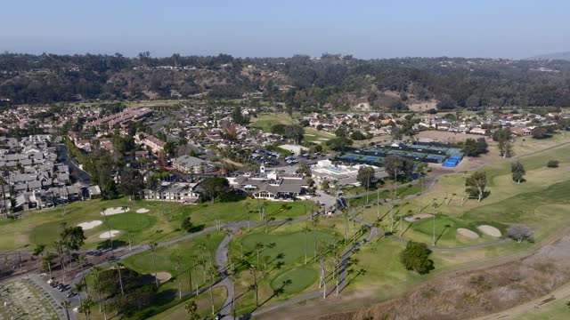 Aerial view of a residential street, palm trees and homes in Rancho Santa Fe.