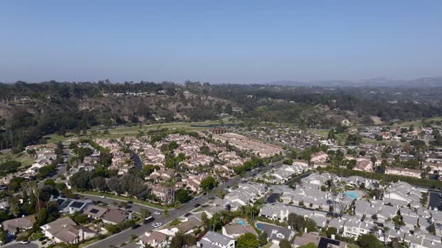 Aerial view of a residential street, homes and traffic in Rancho Santa Fe.