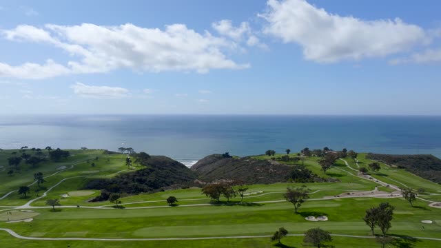 The Iconic Torrey Pines Golf Course in La Jolla looking over the beach and Pacific Ocean | Drone Video