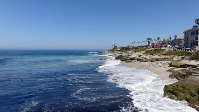 A beautiful day and Windansea Beach in the Beach Barber Tract neighborhood in La Jolla | Drone Video – 1