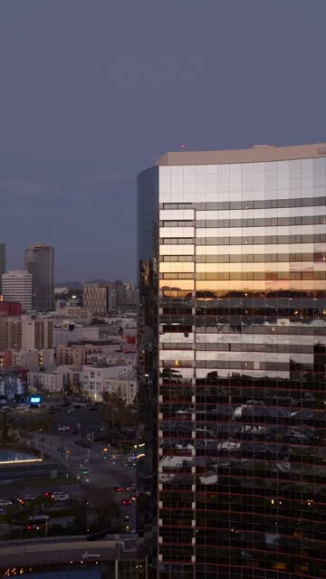 Aerial view of the Marriott Marquis in the Marina District of downtown San Diego during sunset | Vertical Drone Video – 5