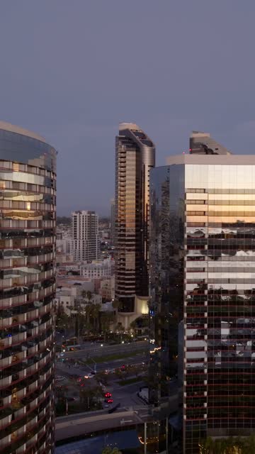 Aerial view of the Marriott Marquis in the Marina District of downtown San Diego during sunset | Vertical Drone Video – 6
