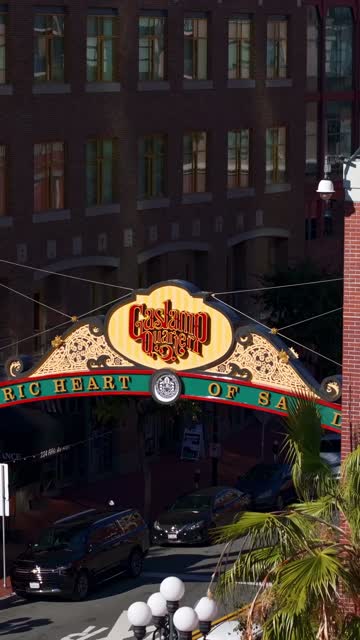 Aerial view of the Gaslamp Quarter sign and 5th Ave in downtown San Diego on a clear sunny day | Vertical Drone Video – 6