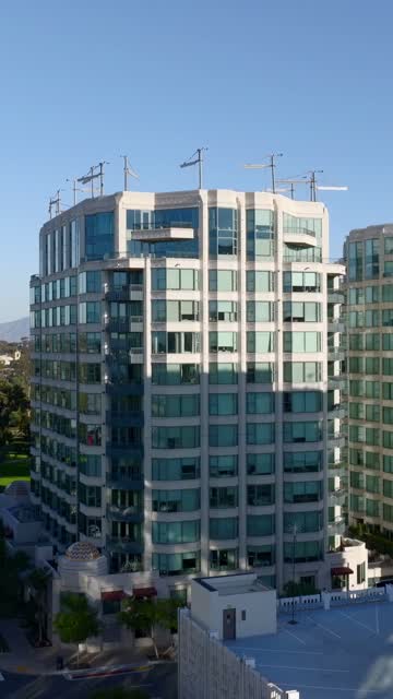 Low aerial view of the downtown streets, palm trees and the buildings at Bankers Hill.