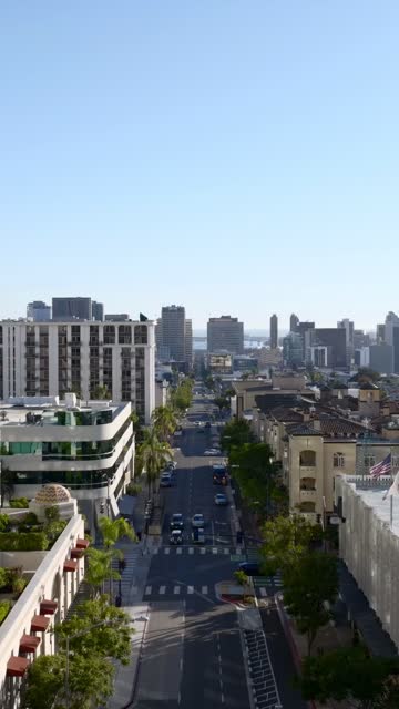 Aerial footage over Bankers Hill and Downtown San Diego on a sunny day | Vertical Drone Video